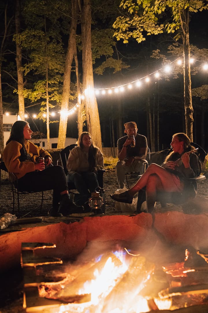 Guests around a campfire